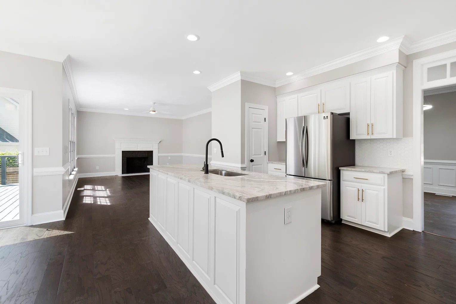 Home Redeemer white kitchen with stainless steel